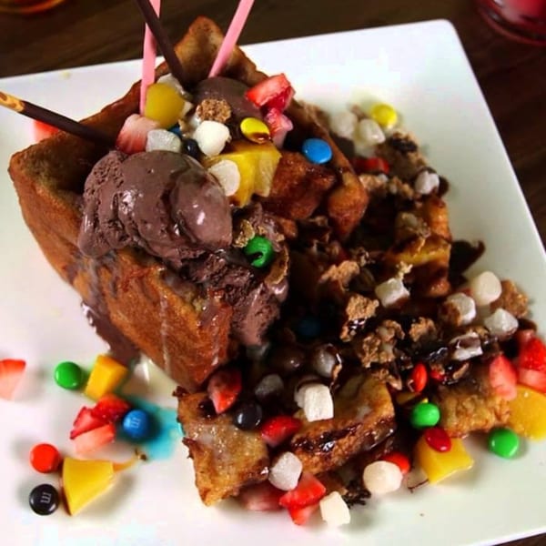 Double Chin's honey toast dessert with chocolate ice cream, fruit, marshmallows, and candy.